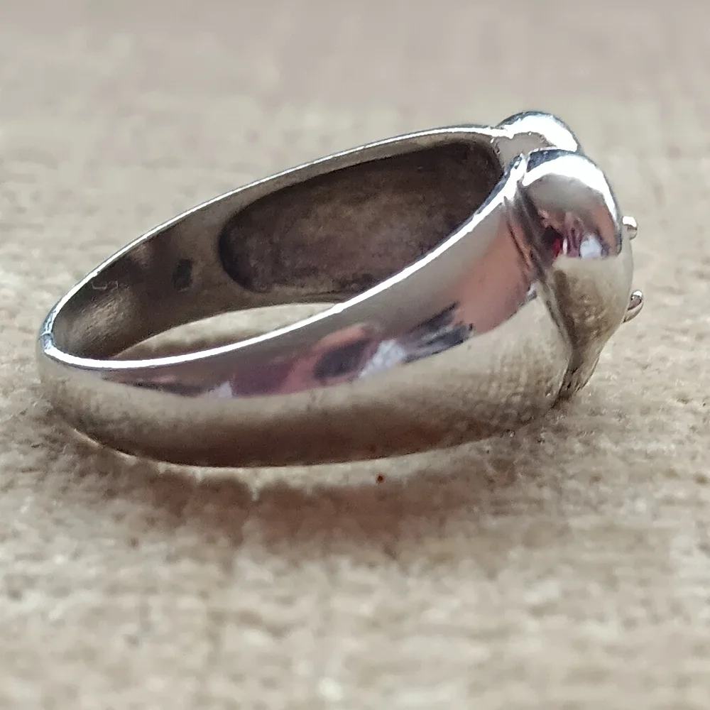 Silver Ring with a Heart Design Featuring a Sparkling Rhinestone Centerpiece.